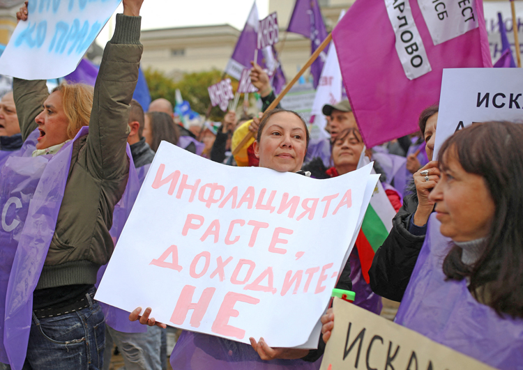 In Bulgaria, thousands of protesters, organized by country’s two largest unions, rallied in Sofia Nov. 11, demand raises to combat inflation. Sign says, “Inflation is rising, our wages are not.”
