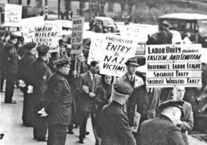 Socialist Workers Party called November 1938 protest in New York demanding Washington open entry to the U.S. to Jewish refugees. Action was called after Kristallnacht, when Nazi storm troopers rounded up 30,000 Jews, destroyed Jewish businesses, synagogues in Germany.