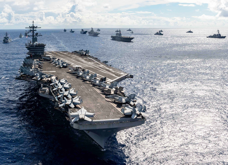 USS Abraham Lincoln leads fleet in Pacific July 28. Over half of $1.66 trillion allocations in spending bill go to U.S. rulers’ military. U.S. is world’s last, declining global imperialist power.