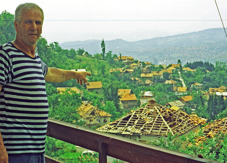Ramiz Beshlija, a shepherd living on the outskirts of Sarajevo, Bosnia, points to destruction from the bombardment by Belgrade in 1992. “Tell the world this is not an ethnic war,” he said.