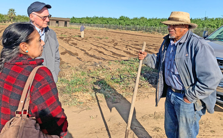Socialist Workers Party members Ellie García and Joel Britton with farmer Will Scott in Fresno, California. Britton participated in National Farmers Union convention, talked to working farmers about need for a labor party, based on the unions and worker-farmer alliance.