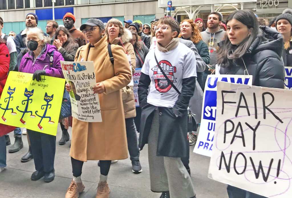 Workers on strike against HarperCollins and supporters protest Jan. 18 in New York City in fight for higher pay and in defense of their union, United Auto Workers Local 2110.