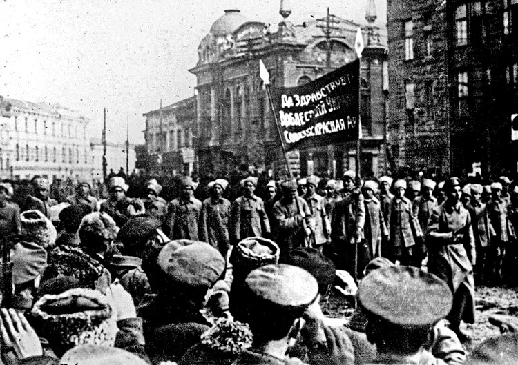 Red Army troops welcomed in Kharkiv, Ukraine, Dec. 8, 1917. Bolshevik Revolution in October 1917 put Russian workers and peasants in power, ended Russian involvement in World War I, put an end to czar’s “prison house of nations,” forming Union of Soviet Socialist Republics.