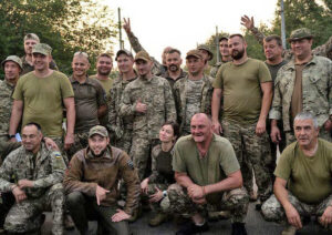 As Russian tanks neared Kyiv, her home, at outset of Putin’s invasion, teacher Yulia Bondarenko volunteered, even though she “never held a rifle” before. Bondarenko, in middle, with her unit before going to fight on the eastern front. They told her, we’re proud to fight alongside you.