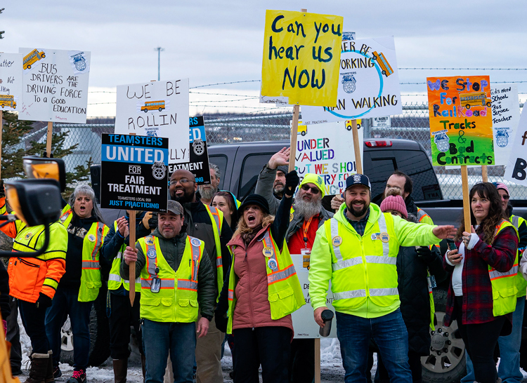 Loren Holmes/Anchorage Daily News via AP School bus drivers strike in Wasilla, Alaska, Jan. 26, demanding adequate heating, headlights, windshield wipers and pay. More workers today are using their unions to fight attacks of bosses and their government