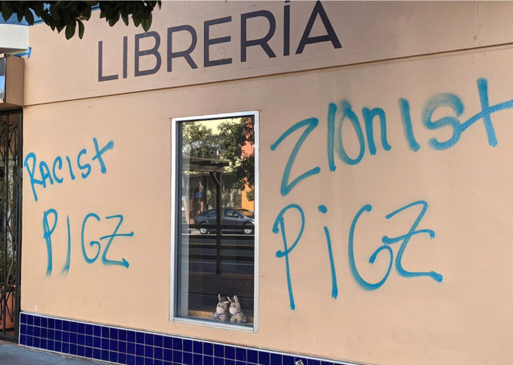 Graffiti on Manny’s bookstore in San Francisco in 2021. Those spewing Jew-hatred use “Zionist” as synonym for Jews. Leftist groups targeted owner, an Afghan refugee who supports Israel’s right to exist. Anti-Jewish attacks have increased in California and elsewhere in recent years.