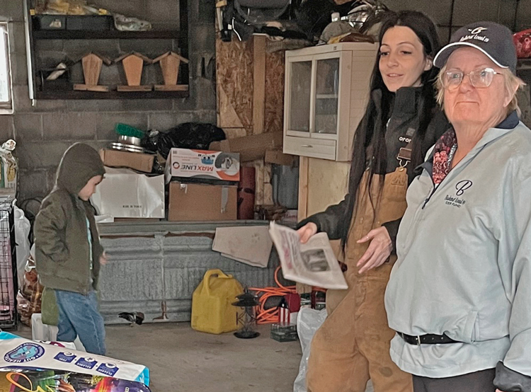 “People from all over have been coming together to help,” Kaylee Ball, holding a copy of the Militant amid donations at her Salem, Ohio, farm, told SWP member Jacquie Henderson March 23. Working people are battling effects of derailment in East Palestine.