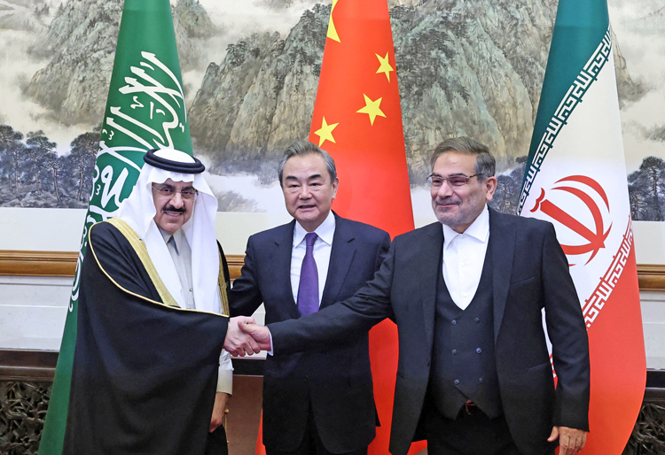 Agreement finalized in Beijing March 10 restoring diplomatic relations between Iran and Saudi Arabia reflects shifts in position of Washington, Beijing in Middle East. Above middle, Wang Yi, China’s top foreign policy official, with representatives from both Arab-Persian Gulf countries.