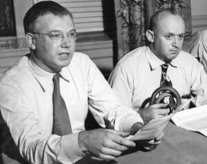 James Kutcher, right, with George Novack at news conference Sept. 1, 1948, in Newark, New Jersey, launching campaign to win back his job and push back against government attacks