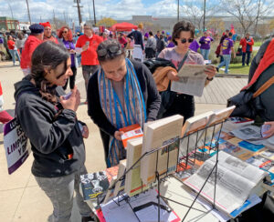 Socialist Workers Party members introduce Militant, literature by party leaders at rally of school workers in Los Angeles March 23 on final day of strike winning better pay, work hours.