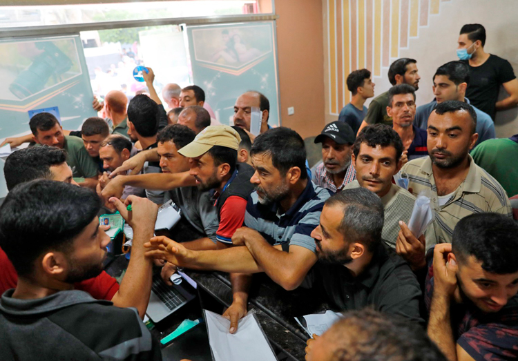 Palestinians in Gaza apply for Israel work permits Oct. 6, 2021. Hamas has accord with Israeli gov’t for 20,000 permits. Islamic Jihad missile killed Gazan worker in Israel during recent clash.