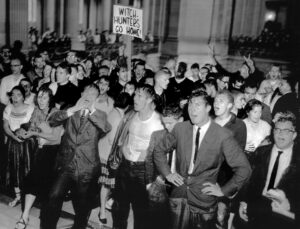 Protest against House Un-American Activities Committee hearing at San Francisco City Hall in 1960, after being hit by cop firehoses. In 1953 HUAC met in the same place targeting unionists as “subversives.” Thousands protested, forcing “government witch hunters to cut and run.”