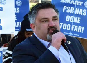 Jared Cassity, SMART-TD, at Dec. 13 rally after Congress barred strike, imposed contract.