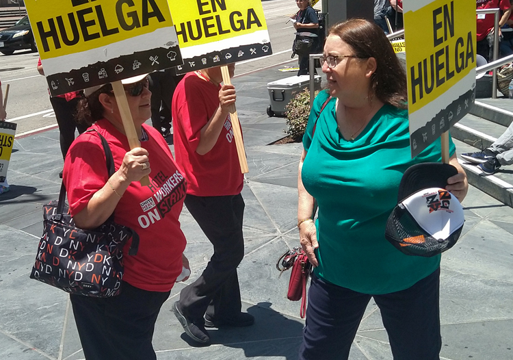 Laura Garza, right, Socialist Workers Party candidate for U.S. Senate from California, joins picket line of striking hotel workers, members of UNITE HERE Local 11, at Intercontinental Hotel, Los Angeles, July 2.
