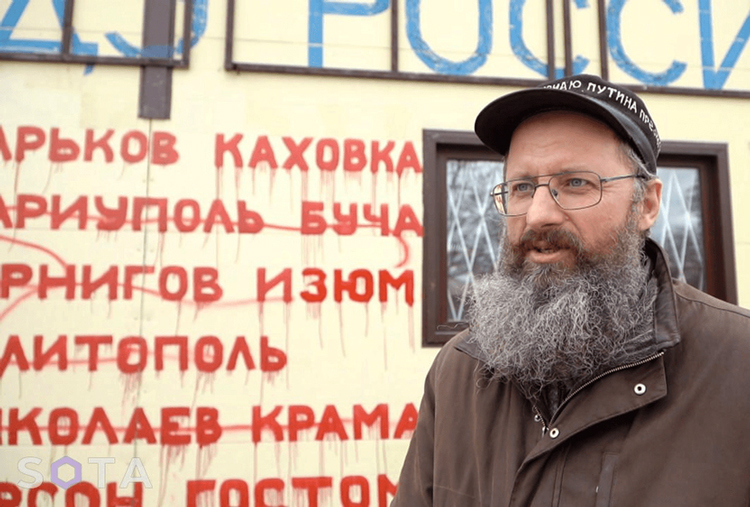 Dmitry Skurikhin painted on his store in the Leningrad region, “Peace to Ukraine, freedom for Russia!” and names of Ukrainian cities hit by Moscow’s invasion. Now under house arrest until July 19 trial for “discrediting” the army, he says many fellow villagers support his anti-war statements.