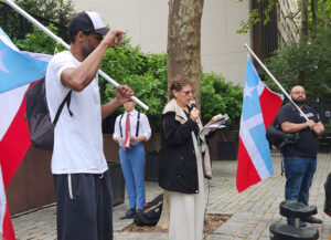 Rachele Fruit, Socialist Workers Party, speaks at rally outside U.N. decolonization committee hearing June 22. She addressed the hearing in support of Puerto Rico independence.