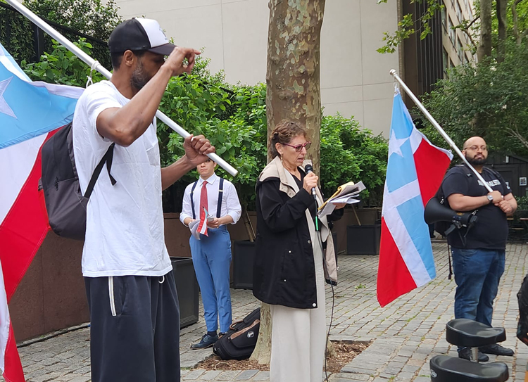 Rachele Fruit, Socialist Workers Party, speaks at rally outside U.N. decolonization committee hearing June 22. She addressed the hearing in support of Puerto Rico independence.