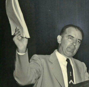 Sen. Joseph McCarthy waves “list” of alleged Communist infiltrators of government agencies during 1950s witch hunt. Similar methods are used by Democrats in attack on Donald Trump.