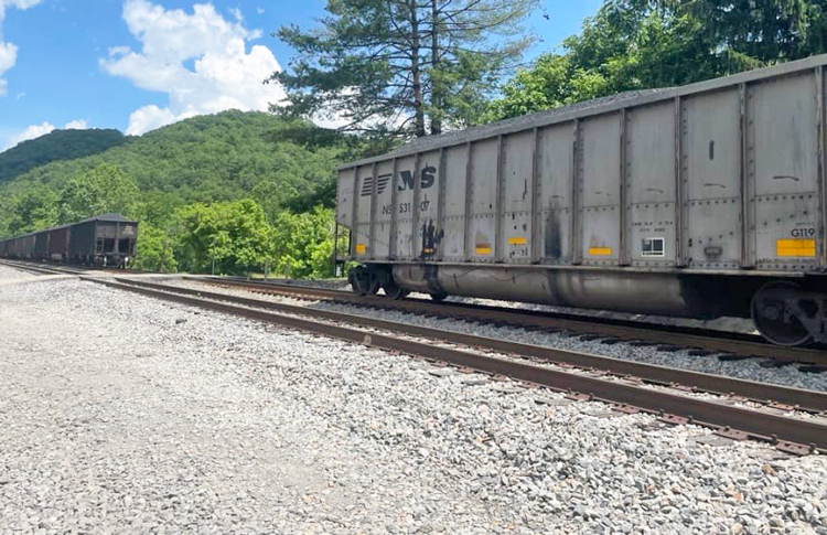 19 cars on Norfolk Southern train derail in Elliston, Virginia, July 6. Inset, Randy Fannon, safety officer for BLET rail union, says profit-driven rail bosses could have caused a disaster.
