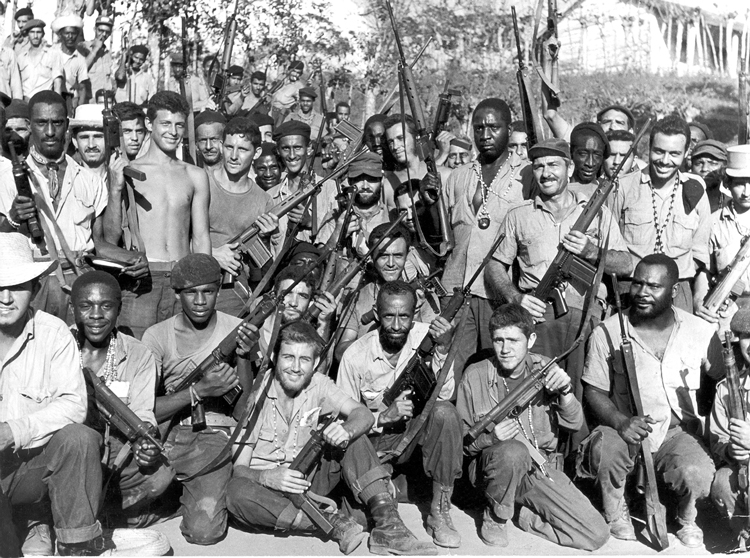 Cuban militia members celebrate successfully defending their socialist revolution against an April 1961 invasion at Playa Girón fomented by the capitalist rulers in Washington.