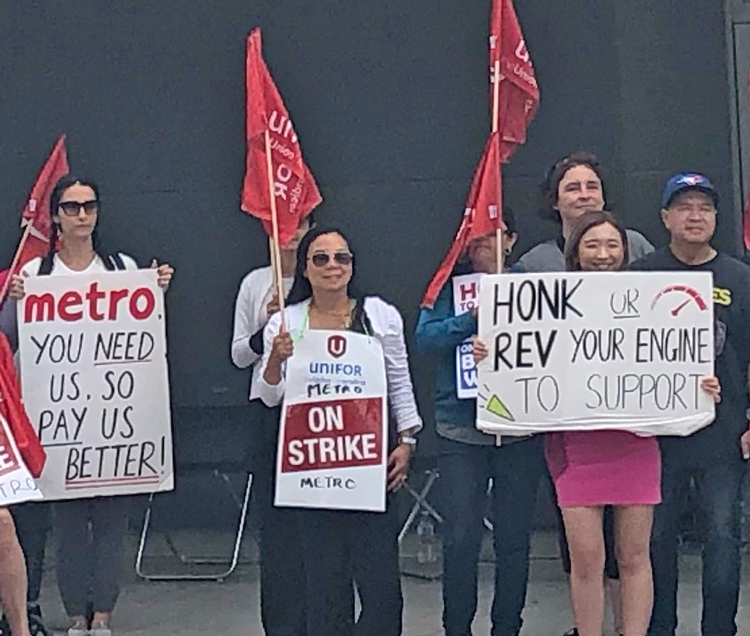 Unifor Local 414 members picket in Toronto Aug. 13. The grocery workers struck July 29 for better wages, benefits.