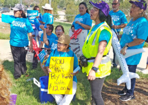 Members of SEIU Airport Workers United rally by Dallas-Fort Worth airport Sept. 19 in fight for improved wages and benefits for contract workers who work for American Airlines.