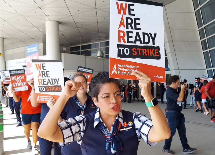 Hundreds of flight attendants picket American Airlines at Dallas-Fort Worth Airport Aug. 30. Without pay raise since December 2019, unionists say they’re ready to strike.