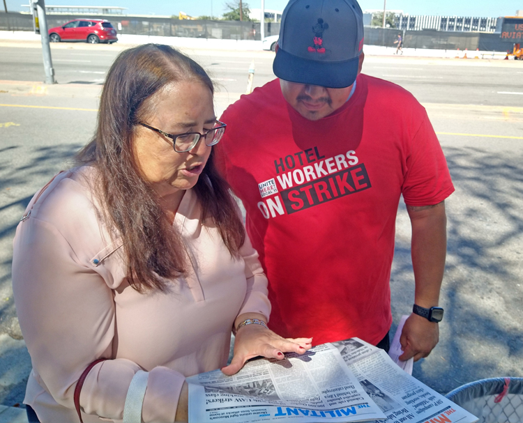 At striking hotel workers’ picket line near Los Angeles airport Oct. 7, Jeffrey Santos told Laura Garza, Socialist Workers Party candidate for U.S. Senate from California, that he works as a banquet server on minimum wage “at five different hotels to get enough hours” to survive. 