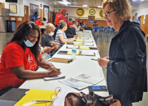 Kimberly Houston, left, financial secretary of strike committee of United Auto Workers Local 276 in Arlington, Texas, speaks with Alyson Kennedy, SWP candidate for U.S. Senate, who brought solidarity to the union hall Oct. 24, first day of walkout by 5,000 workers there.