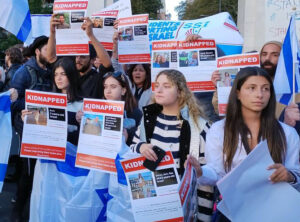 Protesters in New York City’s Washington Square Park Oct. 17 hold posters displaying pictures of hostages seized by Hamas in bloody pogrom 10 days earlier. Protest demanded their release.