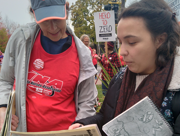 Gabrielle Prosser, right, SWP candidate for Minneapolis City Council, discusses need for unions to fight Jew-hatred with nurse Pat Kohler picketing at Abbott Northwestern Hospital Oct. 26.