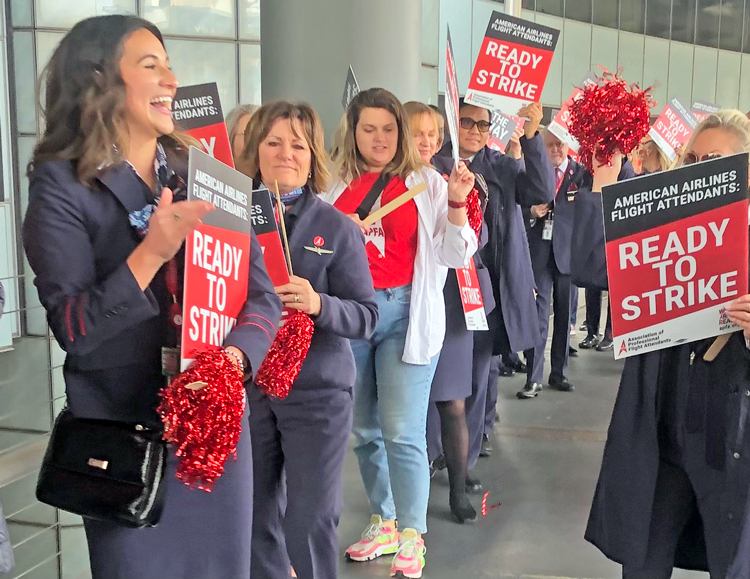 American flight attendants rally at Chicago O’Hare Airport, 12 other cities, Nov. 16 demanding a pay raise, payment for work performed on the ground and more humane work schedules.