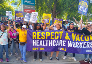 Kaiser health care workers rally at Los Angeles Medical Center Oct. 6 in fight for new contract. After monthslong fight, 85,000 unionists ratified new pact with 21% pay raise over four years.