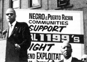 Malcolm X speaks at SEIU Local 1199 rally called to fight for union recognition in New York City in July 1962. Malcolm praised Local 1199 President Leon Davis, who spent 30 days in jail for refusing to comply with court order telling him to call off 56-day hospital workers strike.