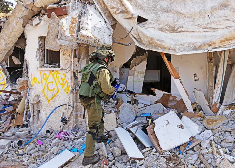 Home destroyed by Tehran-backed Hamas Oct. 7 at Kfar Aza Kibbutz near Gaza border. Hamas death squads had orders to kill as many Jews — and anyone who works with Jews — as possible. Israeli war in Gaza aims to destroy Hamas’ military capability, prevent more pogroms.