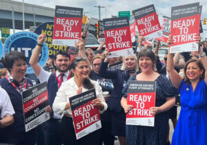 Flight attendants at LaGuardia Airport, New York, after union members voted 99.4% Aug. 30 to authorize strike in contract fight.