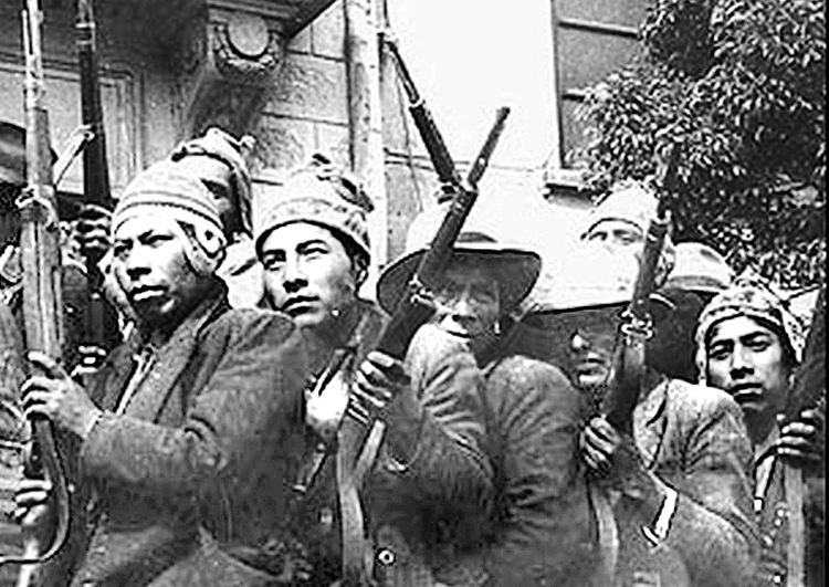 Fighters in 1952 Bolivian national revolution. Prerevolutionary crises in Latin America led Che Guevara, Bolivian fighters to try to open socialist revolution across the continent in 1966.