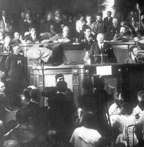 Lenin speaks at Second Congress of Communist International, July 1920, in Petrograd, Russia. Combating persecution of Jews, said Lenin, is vital to advance socialist revolution as only road to ensure rights of all oppressed nations. Under his leadership, Bolshevik Party was on the front lines of the fight to end pogroms.