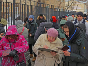 People sign for anti-war presidential candidate Boris Nadezhdin in Moscow Jan. 23. Putin, alarmed as 200,000 people were seen lining up to sign petitions, barred him from ballot.