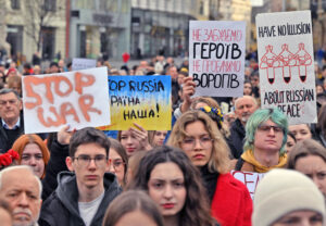 Thousands rally in Prague, Czech Republic, Feb. 24 supporting Ukraine after two years of Moscow’s invasion. Placard, center right, says in Ukrainian: “We will not forget our heroes, we will not forgive our enemies.” Similar protests took place all around the world.