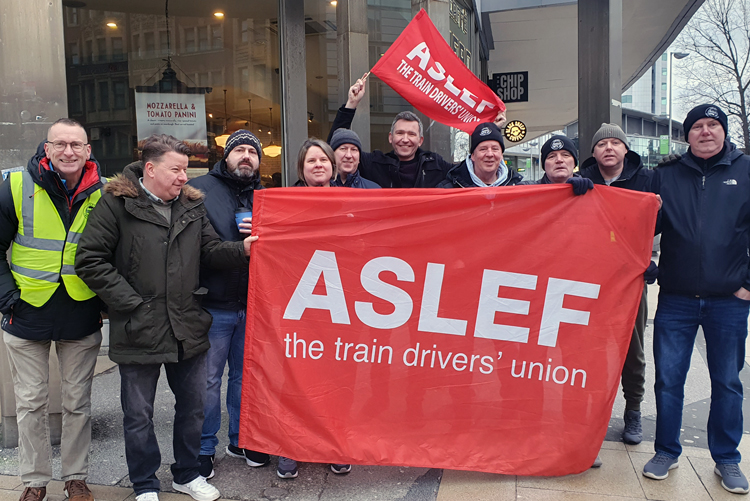 Members of Associated Society of Locomotive Engineers and Firemen, the U.K. train drivers’ union, picket Manchester Piccadilly Jan. 31, protesting new law limiting impact of strike action.