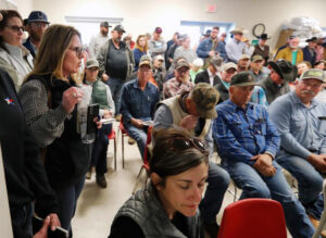 Farmers and ranchers in Canadian, Texas, confront Department of Agriculture representatives March 5 calling for help covering widespread losses from deadly wildfires in Texas Panhandle.