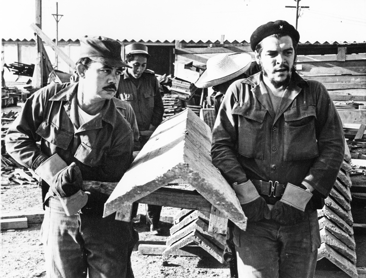 Che Guevara on housing construction brigade, February 1961. Che advocated voluntary labor. 