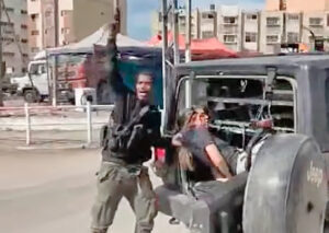 Left, IDF; Above, screen shot from video posted by Hamas Above, bloodied Naama Levy being taken hostage by Hamas Oct. 7. Left, weapons captured by Israeli soldiers inside Shifa Hospital during recent combat with Hamas, Islamic Jihad fighters, who used patients and hospital workers there as human shields.