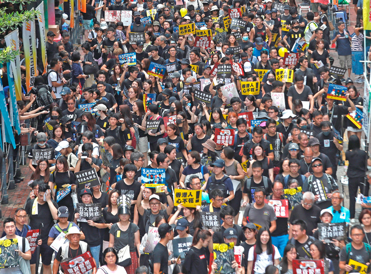 Some 1.7 million people march in Hong Kong Aug. 18, 2019, demanding greater political rights, defying threats by Beijing. Relentless crackdown since has pushed opposition underground.