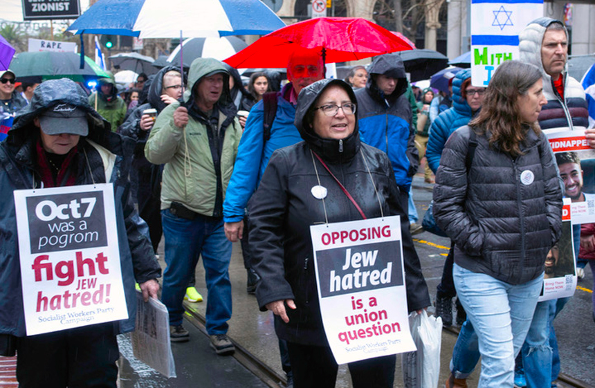 Laura Garza, center, Socialist Workers Party candidate for U.S. Senate from California, at March 3 San Francis-co action against Jew-hatred. SWP promoted, joined in the march.