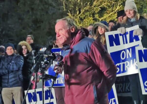 Mike Zilles, president of the Newton Teachers Association in Massachusetts, speaks at strike rally Jan. 18. The union has spoken out against unions calling for imposing a cease-fire on Israel’s war against Hamas or accusing Israel of “genocide.” These false positions “will provoke further antisemitism,” Zilles said, and ignore “the atrocities against Israelis on Oct. 7.”