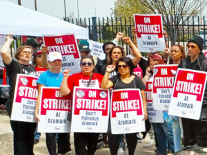 Hundreds of Aramark food service workers who staff concessions at stadiums and arenas in South Philadelphia hold one-day strike April 9 demanding better wages, health care.