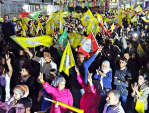 Thousands of Kurdish national rights supporters rally in Van, in eastern Turkey, April 5. Protests forced seating of Kurdish opposition candidate Erdogan tried to bar from office.