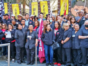 Hotel workers, members of UNITE HERE, join news conference at InterContinental Hotel in Los Angeles March 25 to celebrate strike actions that won contract with large pay raise.